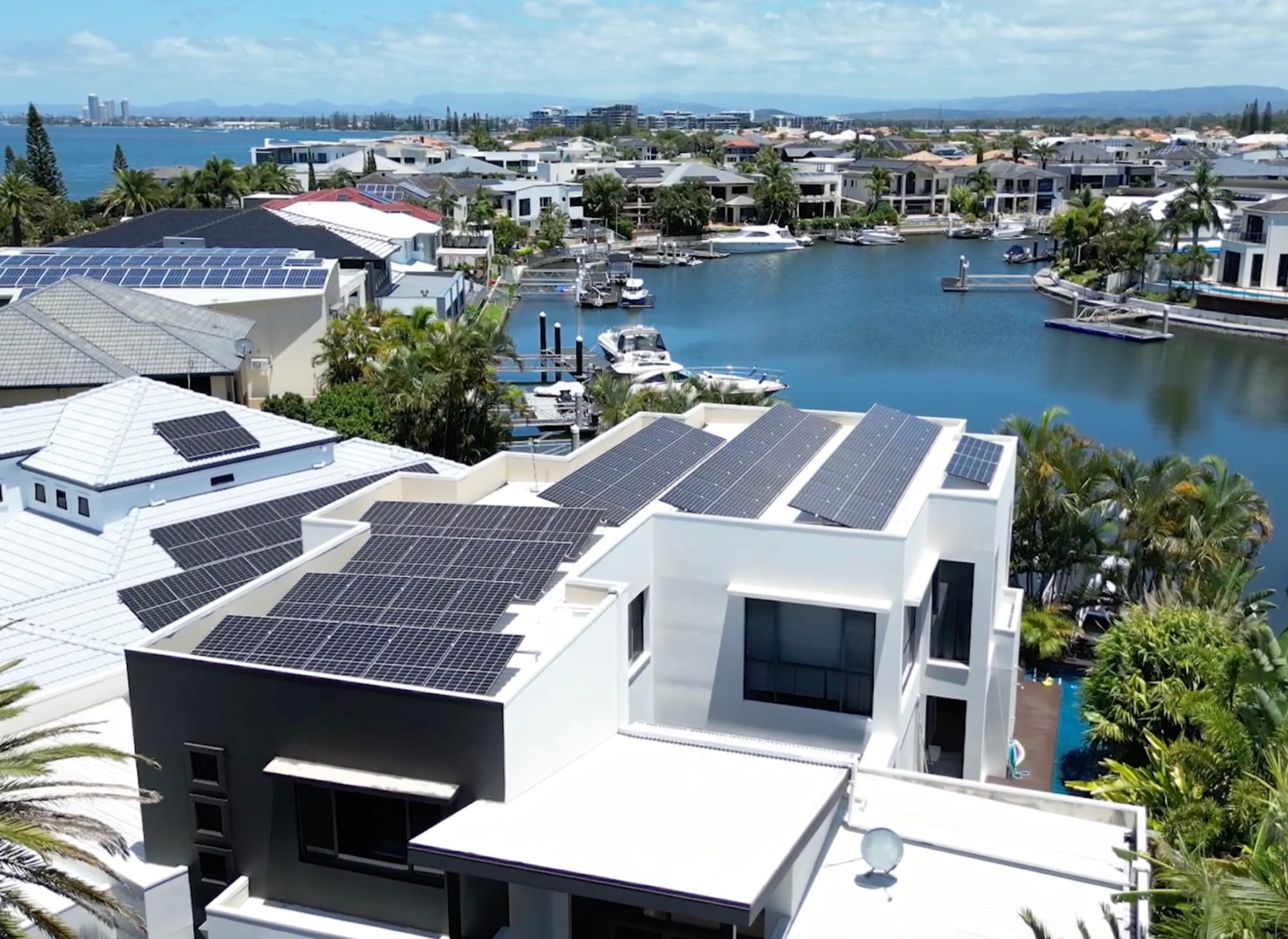 Solar panels installed on a modern Gold Coast waterfront home